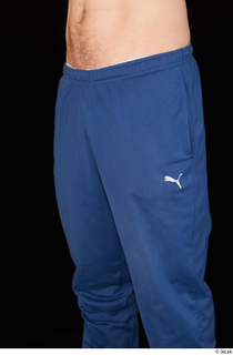 Hamza blue jogging pants dressed thigh 0002.jpg